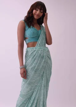 Aqua Blue Saree And Stitched Velvet Blouse With Hanging Crystals