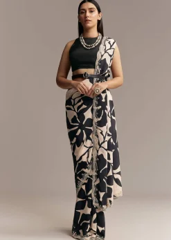 Beige Crepe Saree With Black Floral Print And Embellished Border