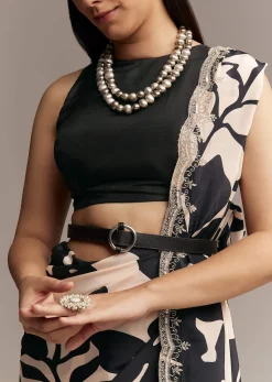 Beige Crepe Saree With Black Floral Print And Embellished Border
