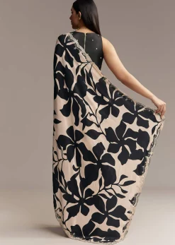 Beige Crepe Saree With Black Floral Print And Embellished Border