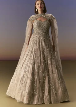Beige Gown With Shoulder Cape And Rich Vertical Embroidery
