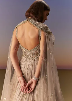 Beige Gown With Shoulder Cape And Rich Vertical Embroidery
