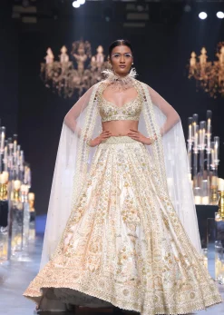 Beige Raw Silk Bridal Lehenga Set With Pearl Tassels And 3D Embroidery