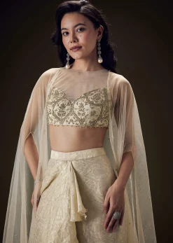 Beige Zardozi Embroidered Blouse With Brocade Drape Skirt And Net Cape