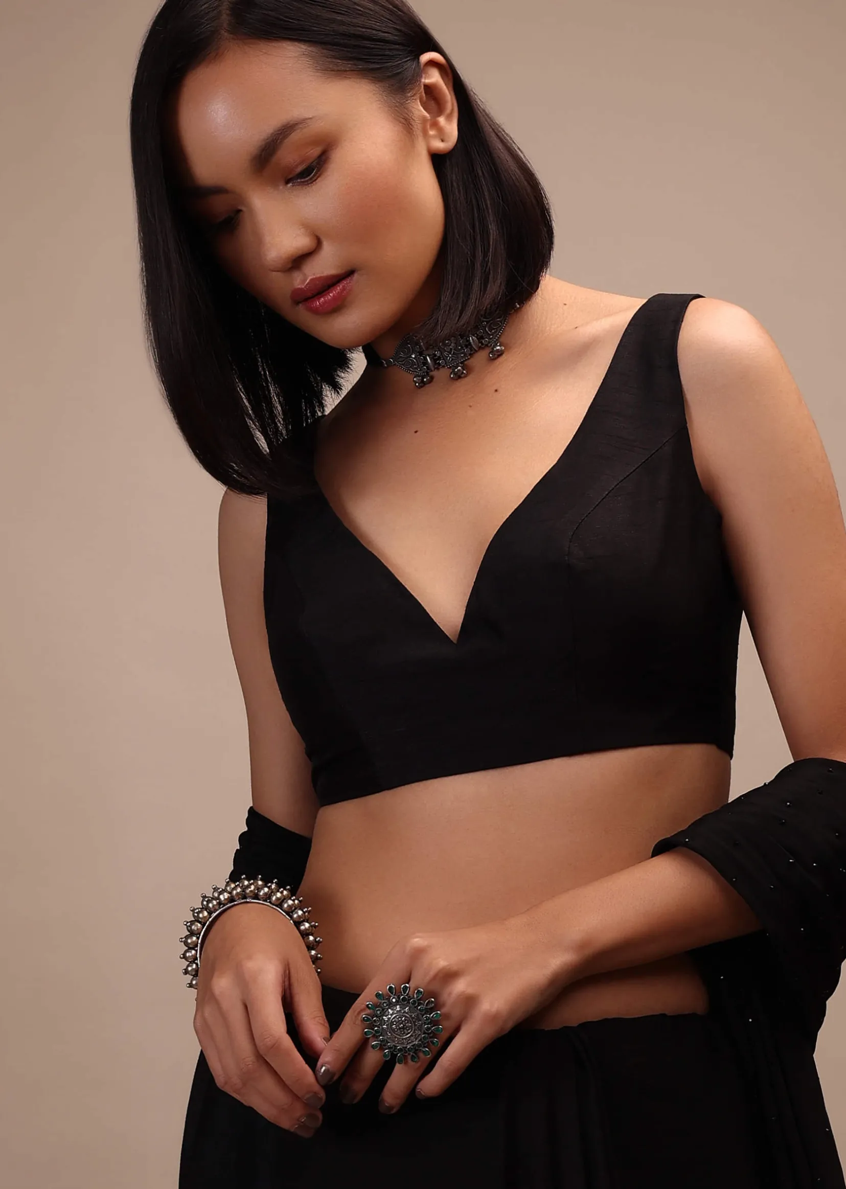 Black Sleeveless Blouse In A Sweetheart Neck Line Straight Hem Line With Back Zip Closure