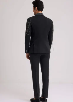 Black Suiting Tuxedo With Metallic Chain And Stone Work