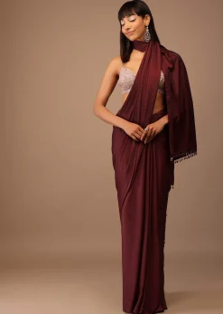 Blood Red Satin Saree With Fringes On The Pallu Paired With Hand Embroidered Bustier
