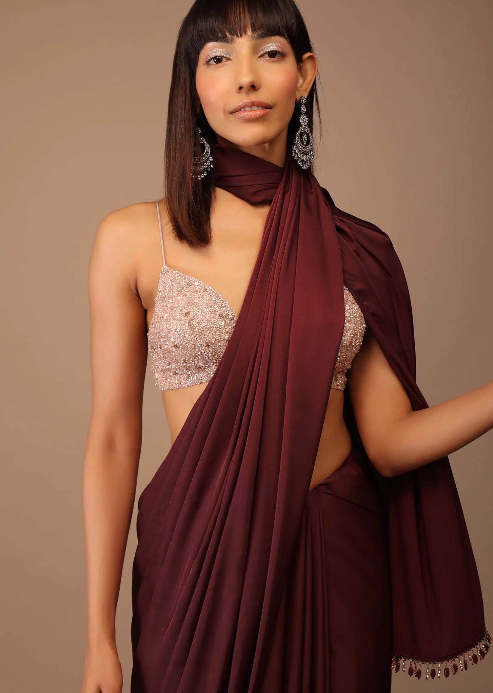 Blood Red Satin Saree With Fringes On The Pallu Paired With Hand Embroidered Bustier