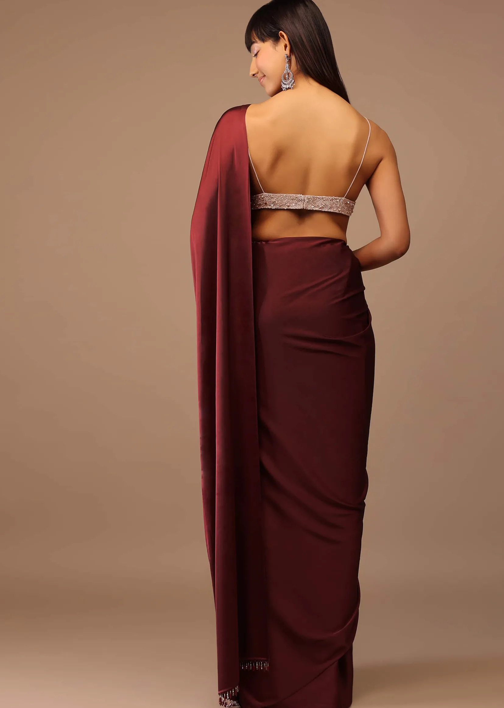 Blood Red Satin Saree With Fringes On The Pallu Paired With Hand Embroidered Bustier