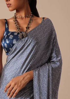 Blue Printed Saree In Satin With Tassel Detail And Unstitched Blouse Fabric