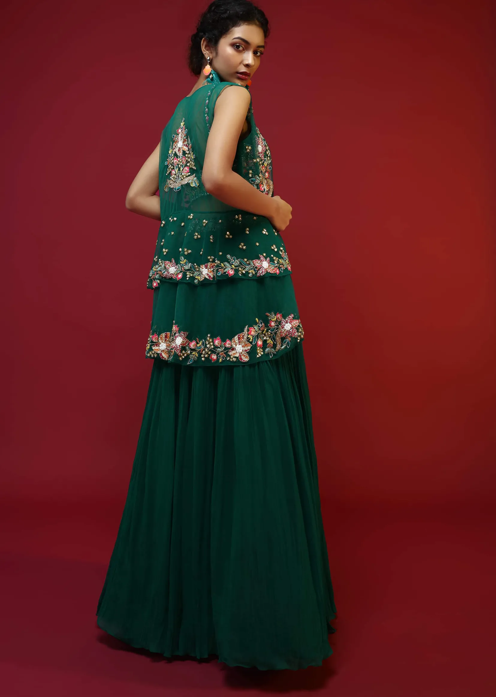 Bottle Green Lehenga Choli And Sleeveless Peplum Jacket Adorned With Colorful Resham And Moti Embroidered Flowers