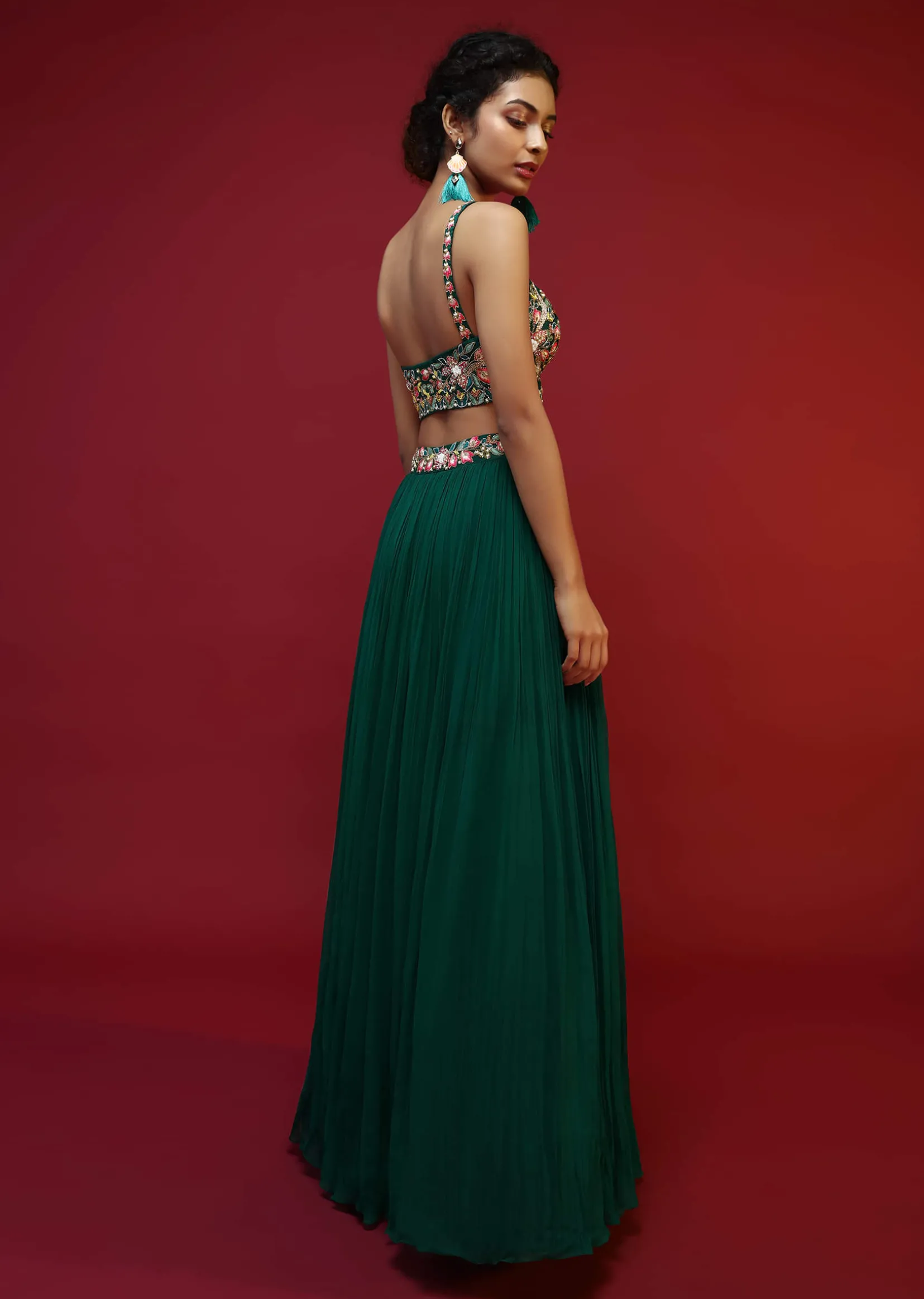 Bottle Green Lehenga Choli And Sleeveless Peplum Jacket Adorned With Colorful Resham And Moti Embroidered Flowers