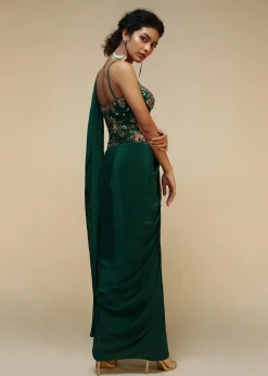 Bottle Green Saree Gown With A Crepe Cowl Drape And Sheer Embroidered Net Bodice With Colorful Resham Flowers