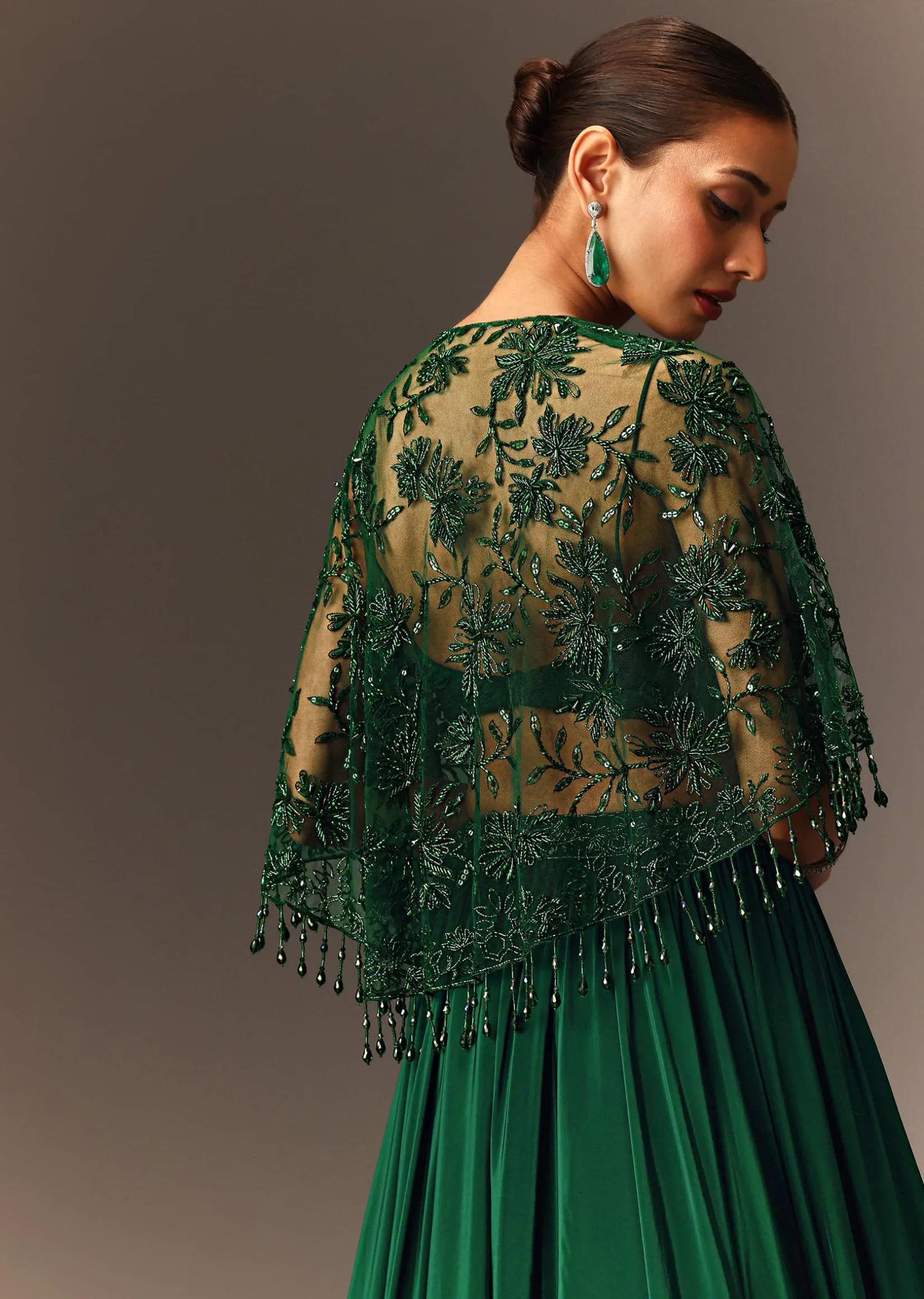 Bottle Green Tiered Lehenga With Net Cape