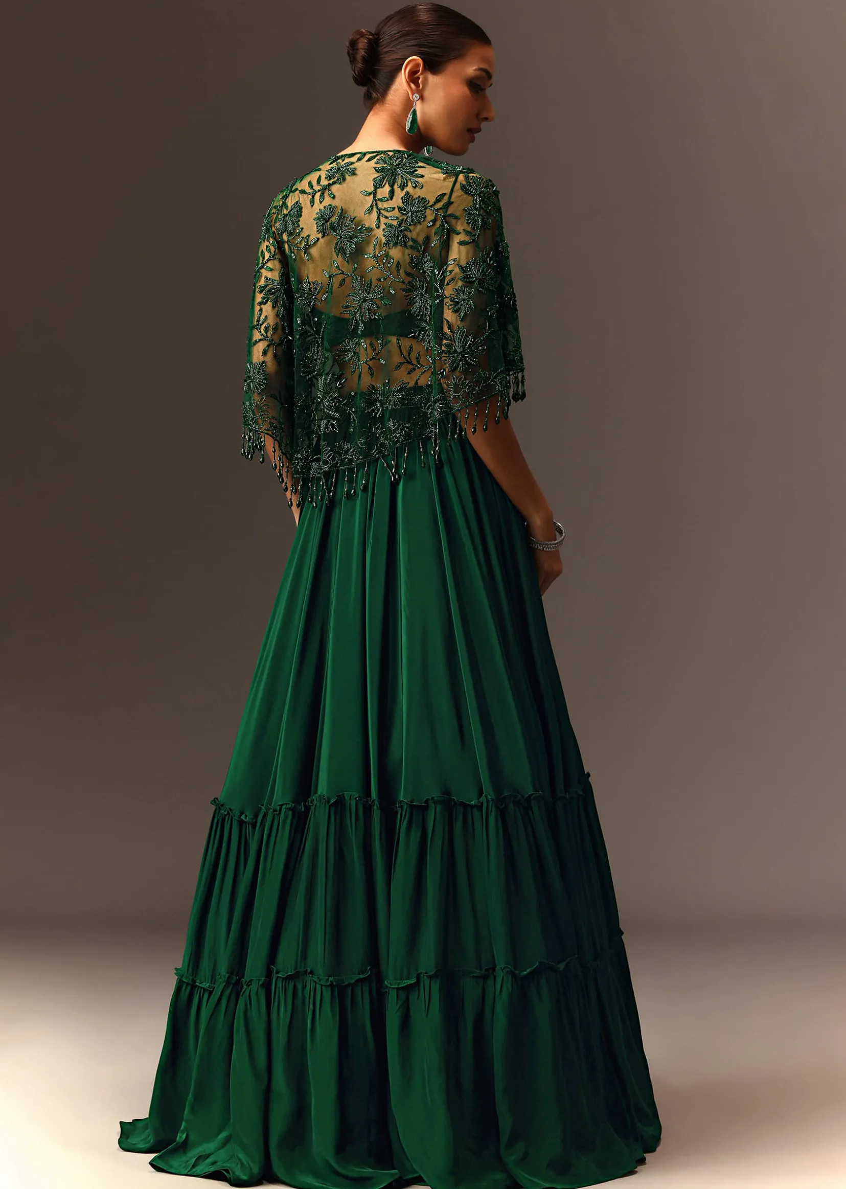 Bottle Green Tiered Lehenga With Net Cape