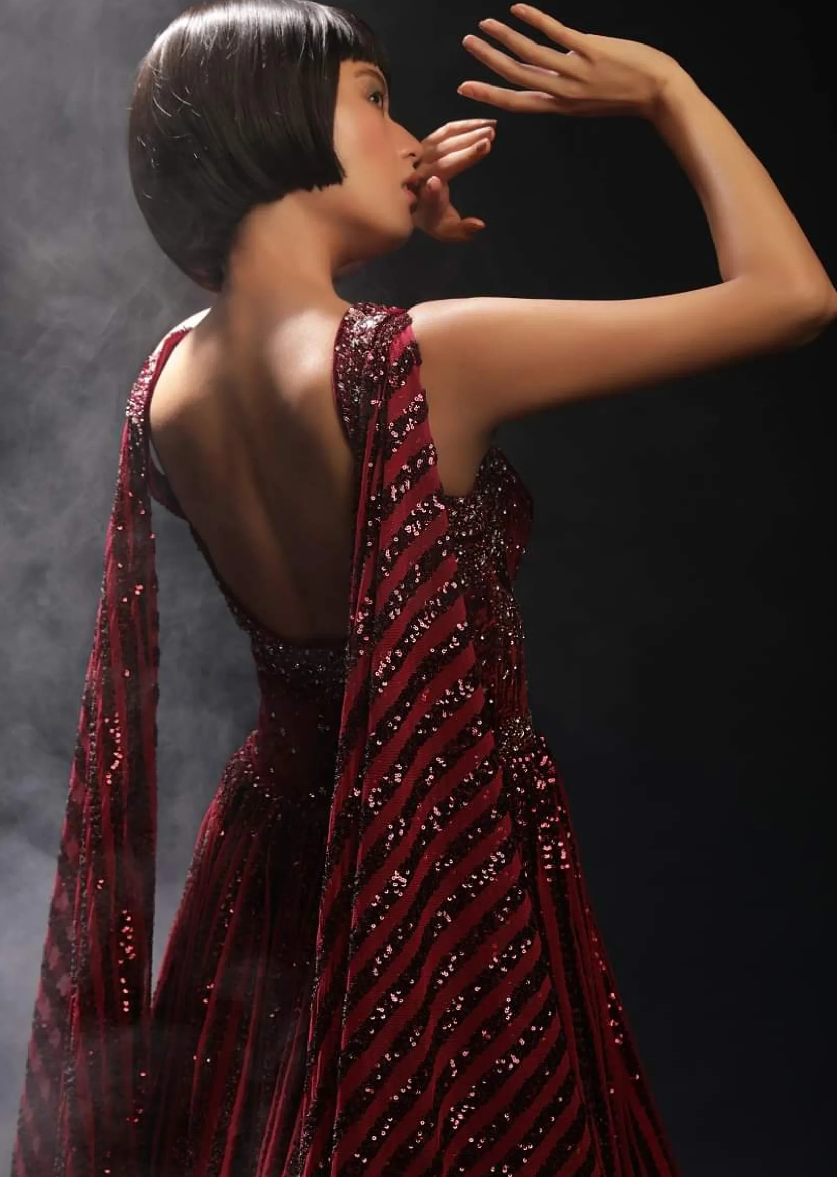 Burgundy Gown In Sequins Embellished Net With Attached Cape And Cut Dana Accented Front Cut Bodice