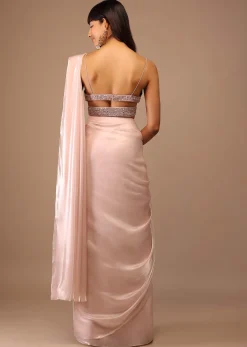 Candy Pink Organza Saree With A Heavily Embroidered Bustier And Belt