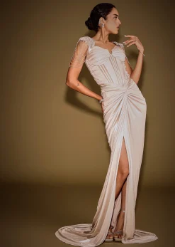 Champagne Drape Gown With Embroidered Shoulder Cape And Tassel Detailing