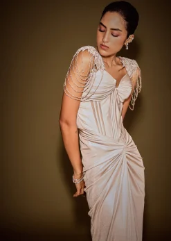 Champagne Drape Gown With Embroidered Shoulder Cape And Tassel Detailing