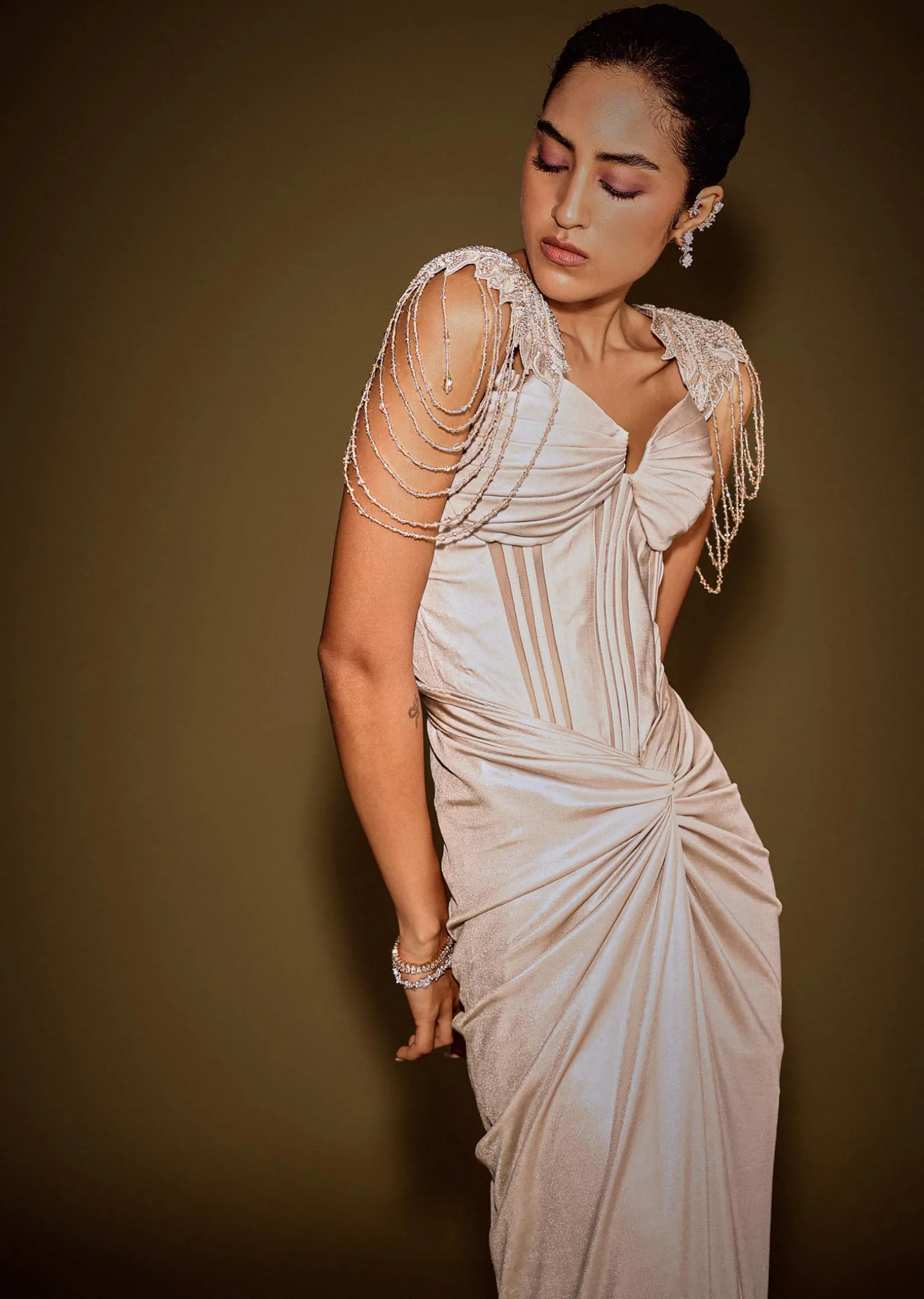 Champagne Drape Gown With Embroidered Shoulder Cape And Tassel Detailing