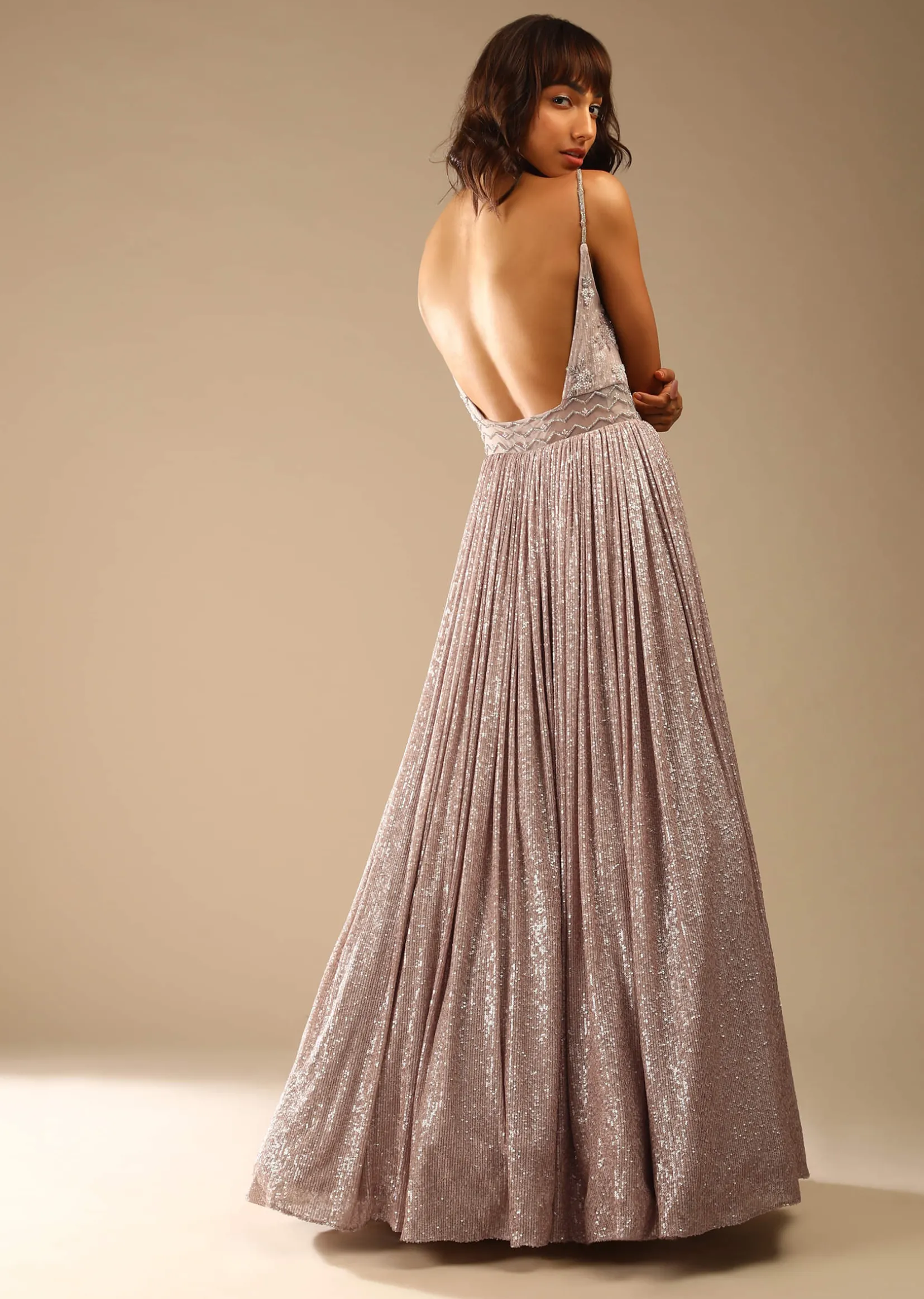 Champagne Gown Embellished In Sequins With Cut Dana Embellished Sheer Net On The Waist And Criss Cross Straps On The Neckline Online - Kalki Fashion