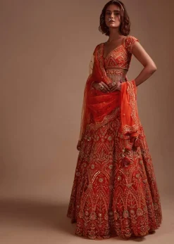 Coral Orange Lehenga Choli In Net With Mirror And Sequins Embroidered Floral And Mughal Embroidery Along With Belt Detailing