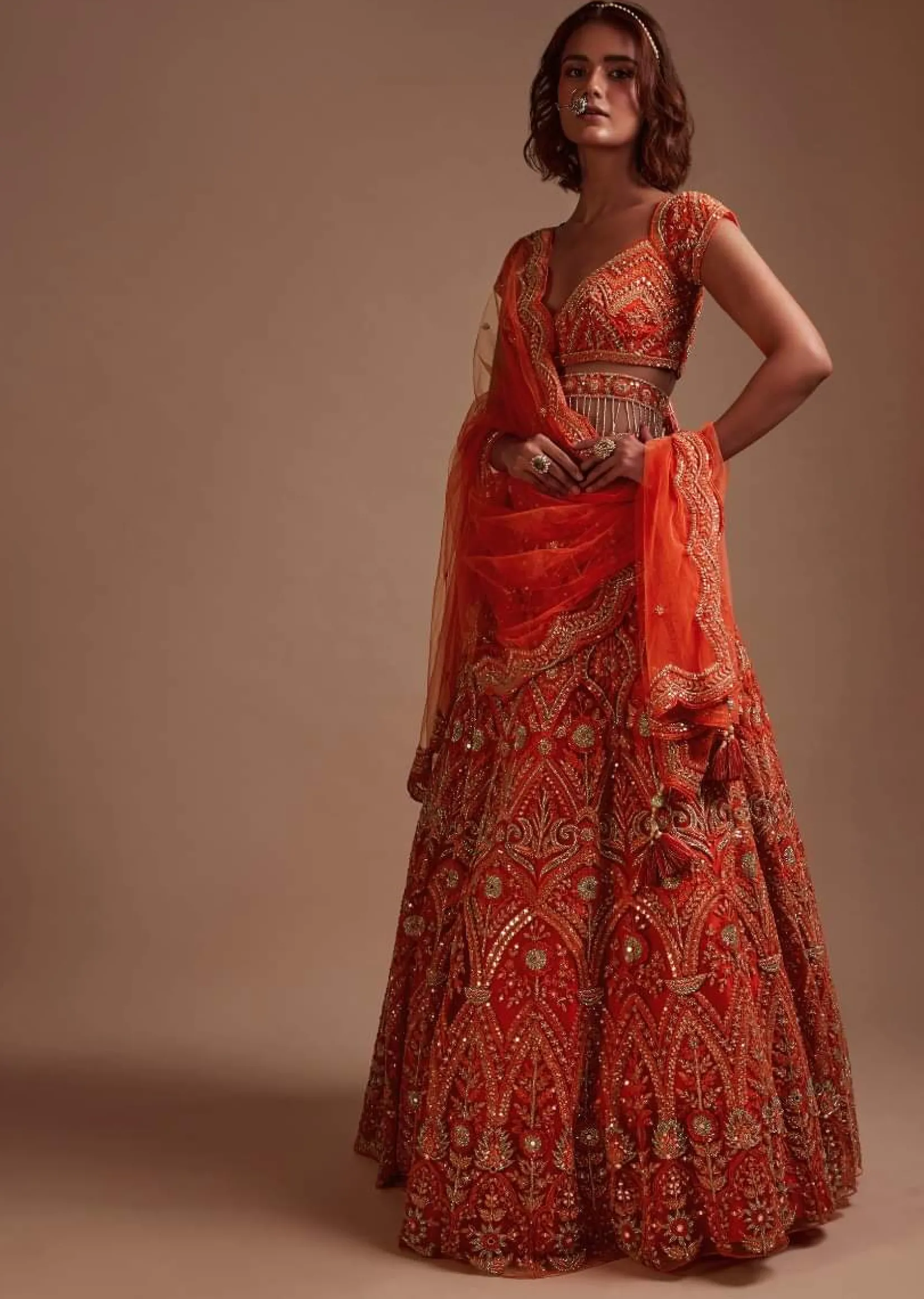 Coral Orange Lehenga Choli In Net With Mirror And Sequins Embroidered Floral And Mughal Embroidery Along With Belt Detailing