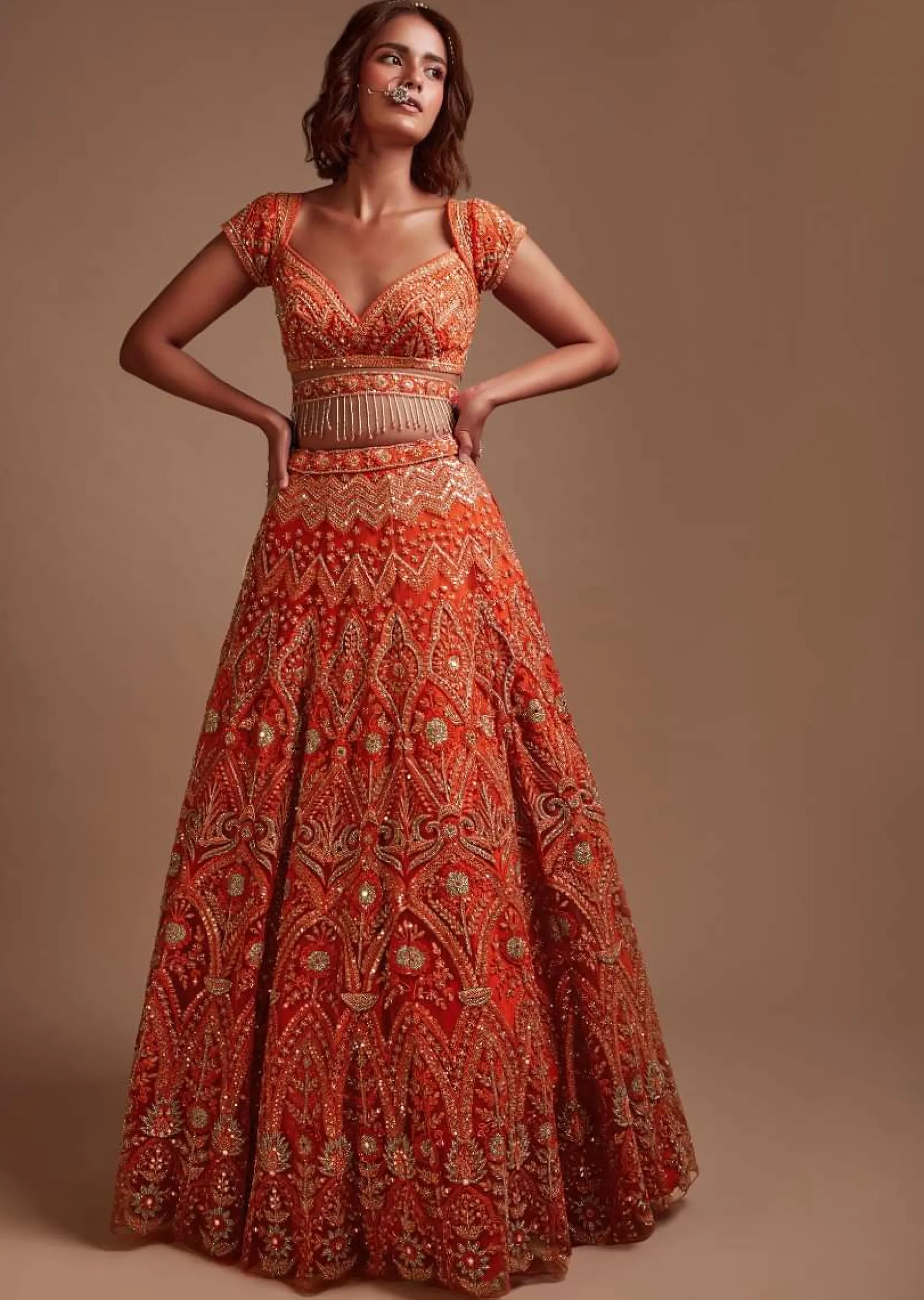 Coral Orange Lehenga Choli In Net With Mirror And Sequins Embroidered Floral And Mughal Embroidery Along With Belt Detailing
