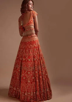 Coral Orange Lehenga Choli In Net With Mirror And Sequins Embroidered Floral And Mughal Embroidery Along With Belt Detailing