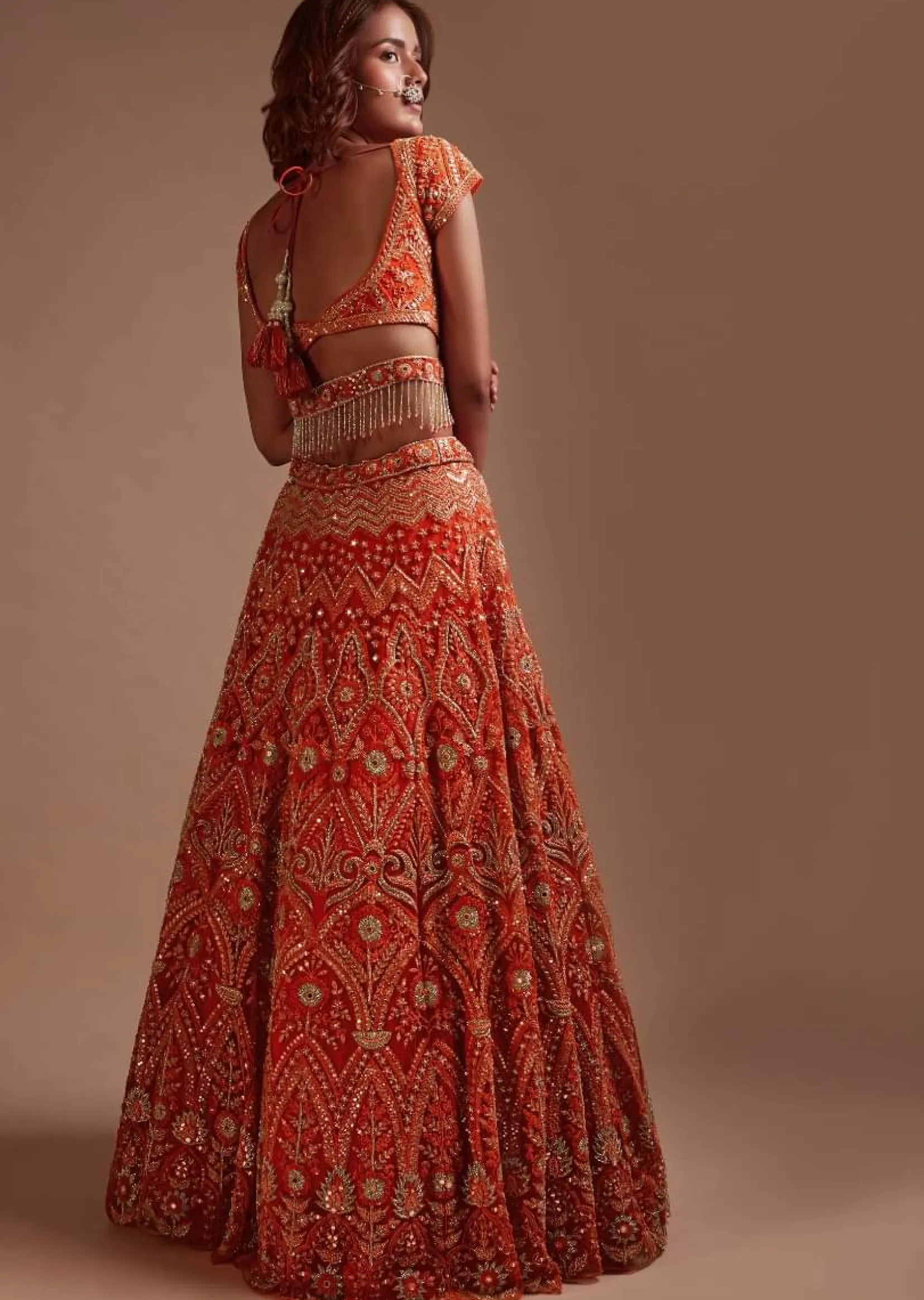 Coral Orange Lehenga Choli In Net With Mirror And Sequins Embroidered Floral And Mughal Embroidery Along With Belt Detailing