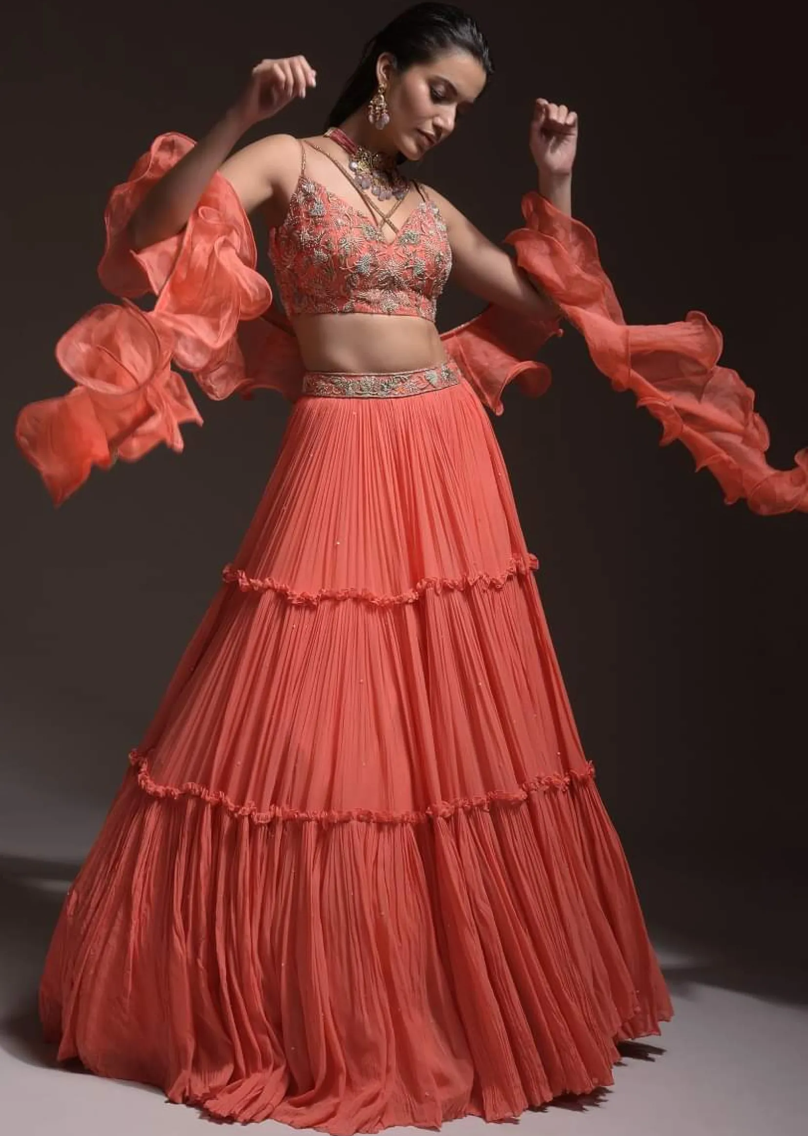 Coral Tiered Skirt And Crop Top With Cutdana Embellished Floral Blossoms And Ruffle Dupatta