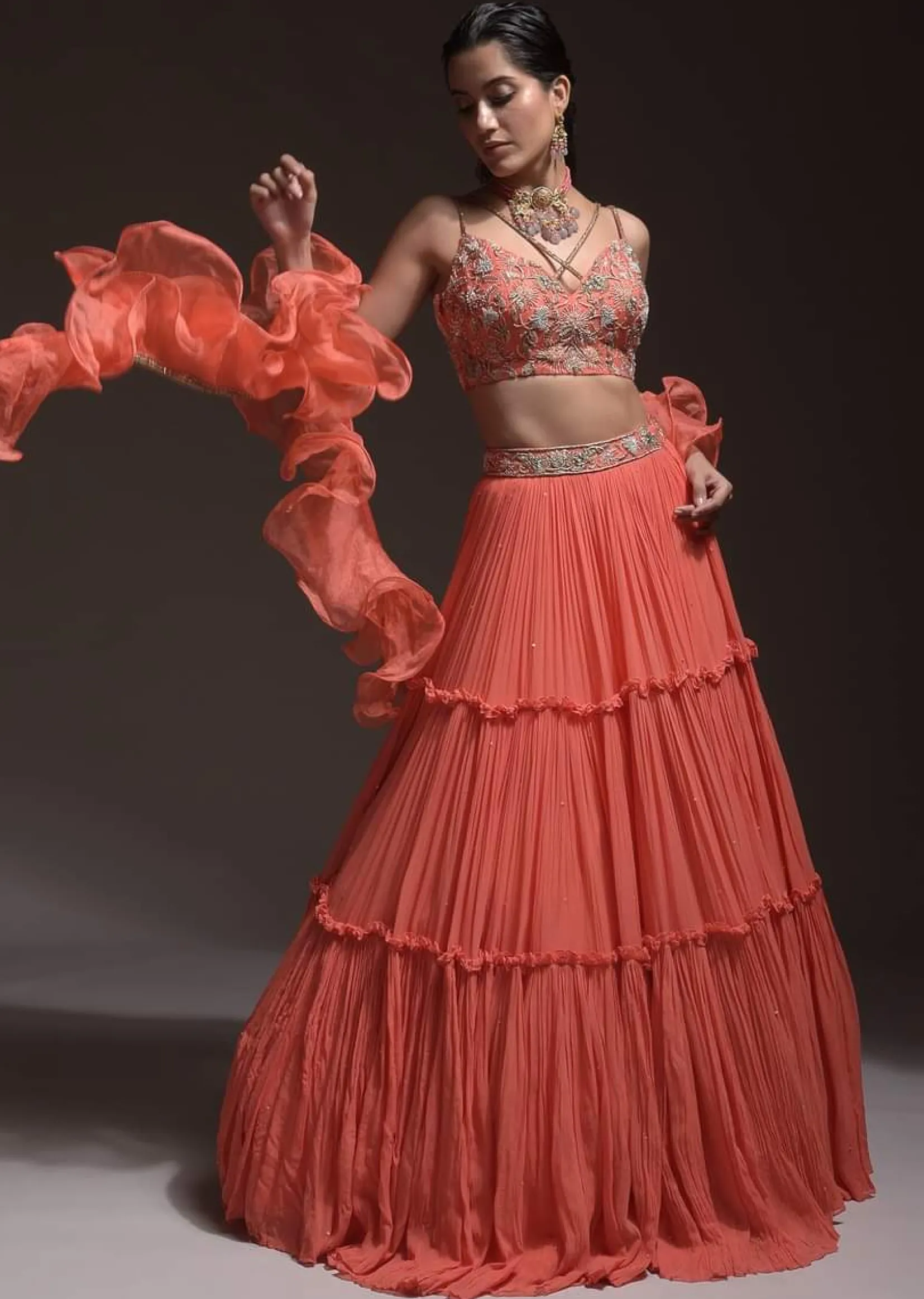 Coral Tiered Skirt And Crop Top With Cutdana Embellished Floral Blossoms And Ruffle Dupatta