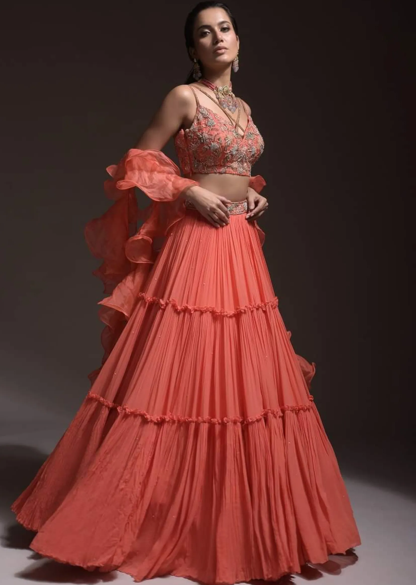 Coral Tiered Skirt And Crop Top With Cutdana Embellished Floral Blossoms And Ruffle Dupatta