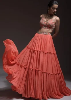 Coral Tiered Skirt And Crop Top With Cutdana Embellished Floral Blossoms And Ruffle Dupatta
