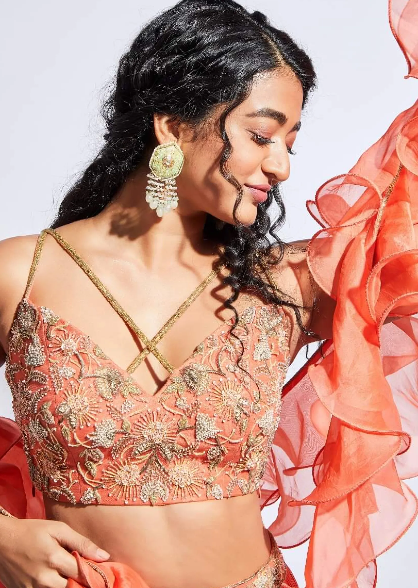 Coral Tiered Skirt And Crop Top With Cutdana Embellished Floral Blossoms And Ruffle Dupatta