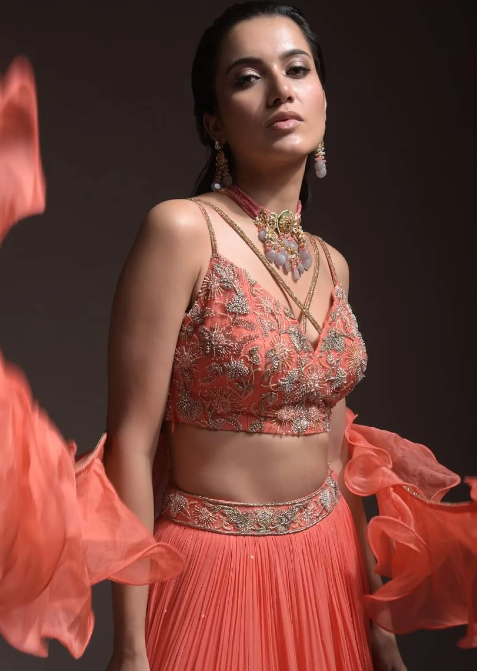 Coral Tiered Skirt And Crop Top With Cutdana Embellished Floral Blossoms And Ruffle Dupatta