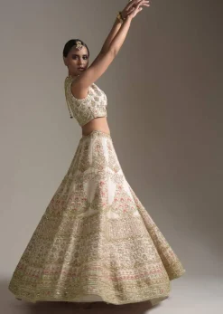 Creamy Pink Lehenga Choli In Raw Silk With Pink Resham And Zardosi Embroidered Floral Kalis Online - Kalki Fashion