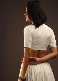 Egret White Half-Sleeved Blouse With Long Collar Neckline. Front Hook Closure With A Straight Hemline.