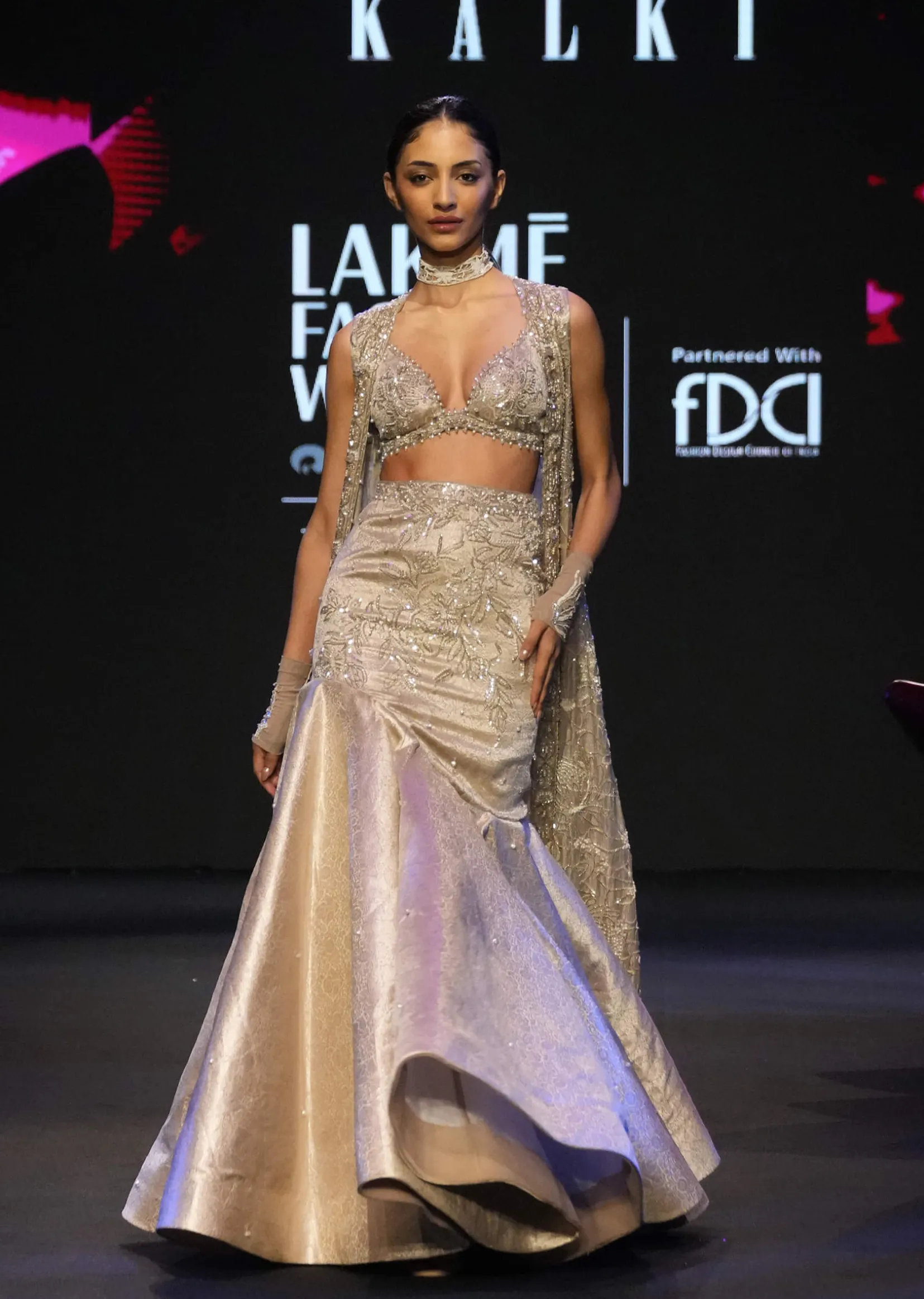 Gold Banarasi Embroidered Long Jacket With Sleeveless Blouse And Fishcut Lehenga