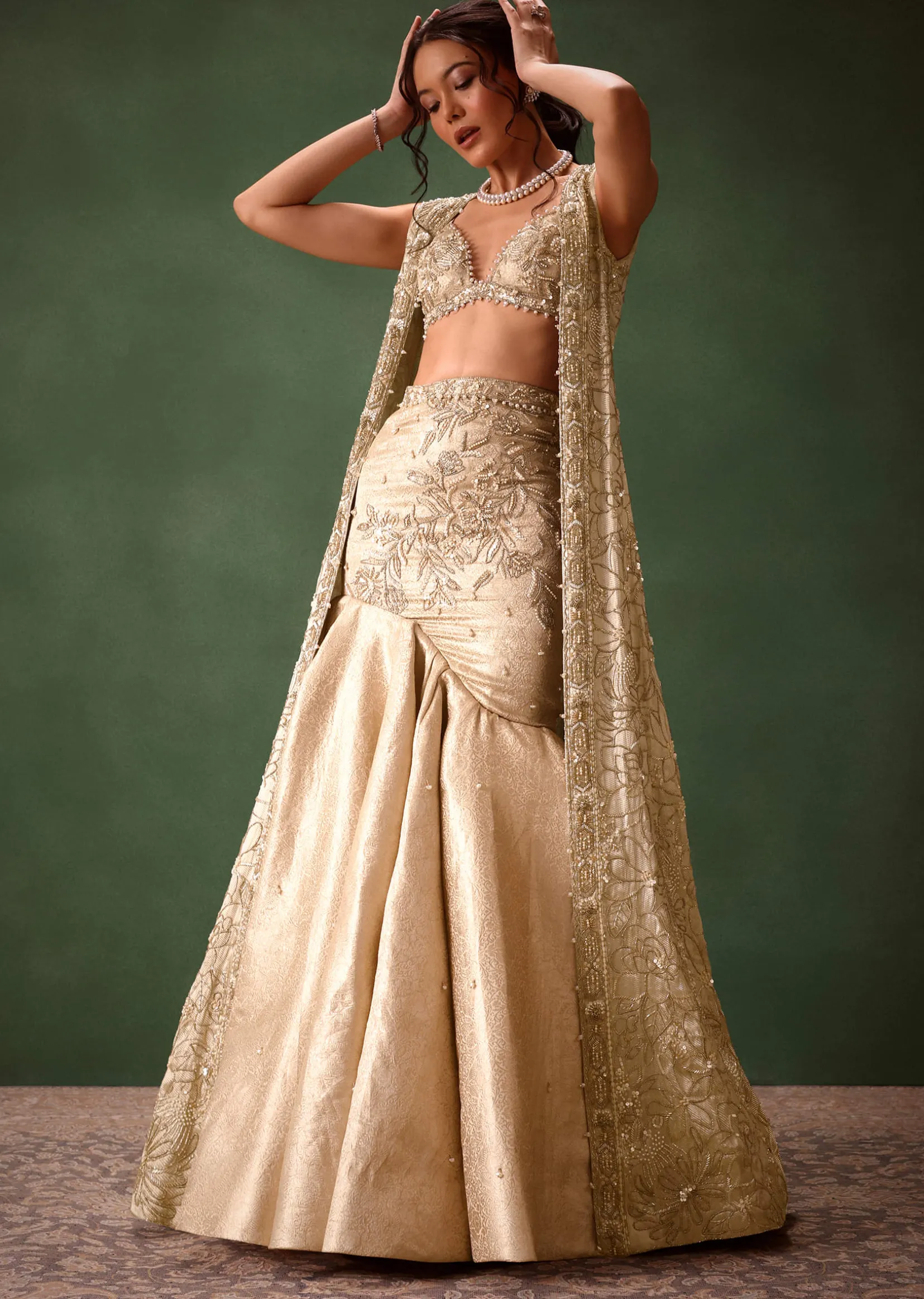 Gold Banarasi Embroidered Long Jacket With Sleeveless Blouse And Fishcut Lehenga