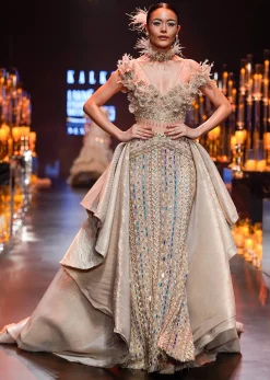 Gold Draped Gown With Trail Detail And Heavy Embroidery