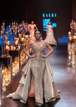 Gold Draped Gown With Trail Detail And Heavy Embroidery
