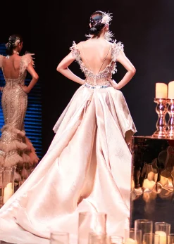 Gold Draped Gown With Trail Detail And Heavy Embroidery