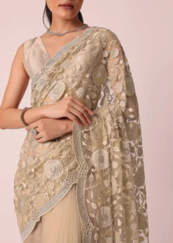 Gold Net Saree With Stone Studded And Floral work And Unstitched Blouse Piece