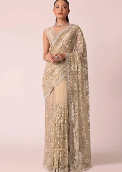 Gold Net Saree With Stone Studded And Floral work And Unstitched Blouse Piece