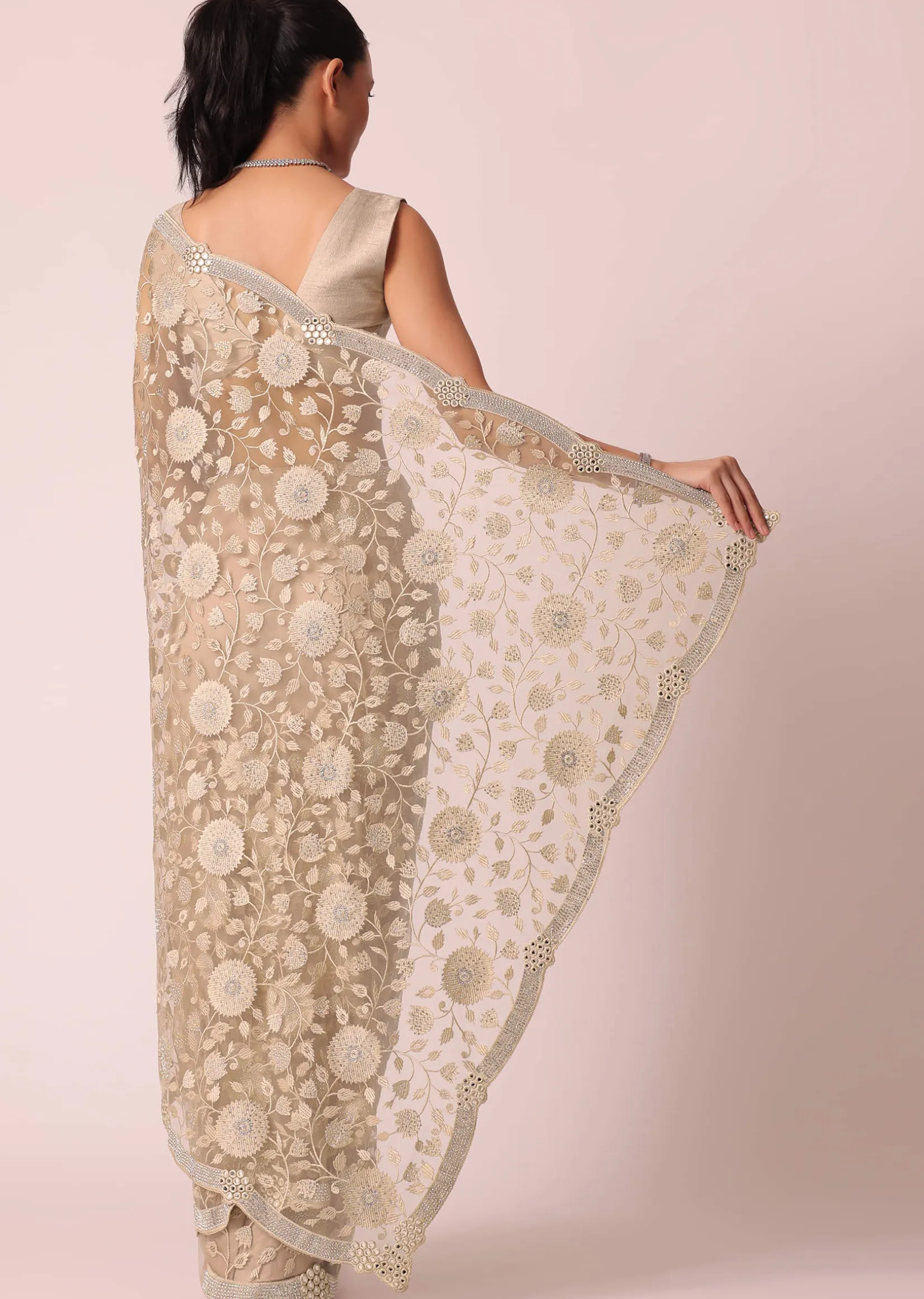 Gold Net Saree With Stone Studded And Floral work And Unstitched Blouse Piece
