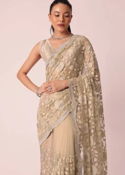 Gold Net Saree With Stone Studded And Floral work And Unstitched Blouse Piece