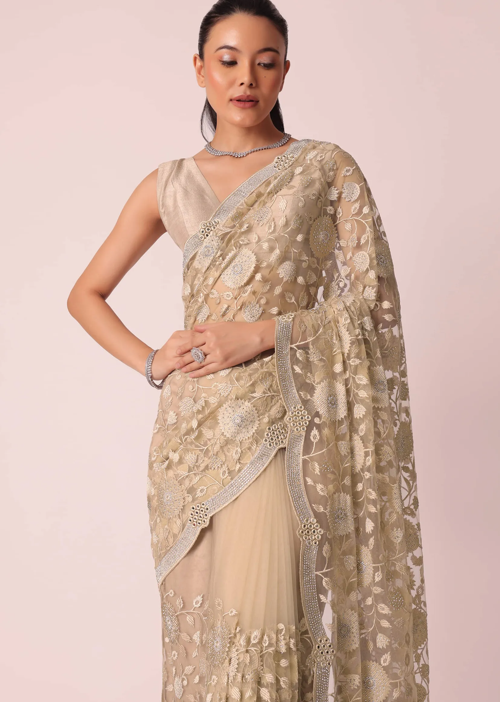 Gold Net Saree With Stone Studded And Floral work And Unstitched Blouse Piece