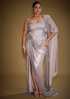 Gold One Shoulder Drape Gown With Embroidered Floral Brooch And Trail