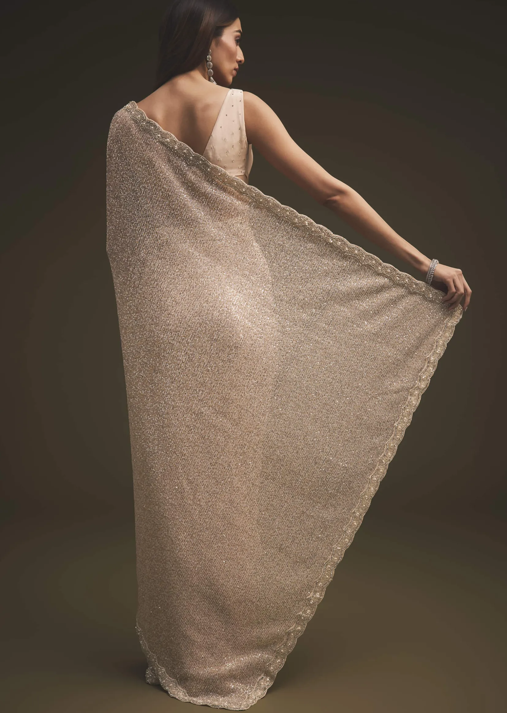 Gold Sequins Saree With An Embellished Border